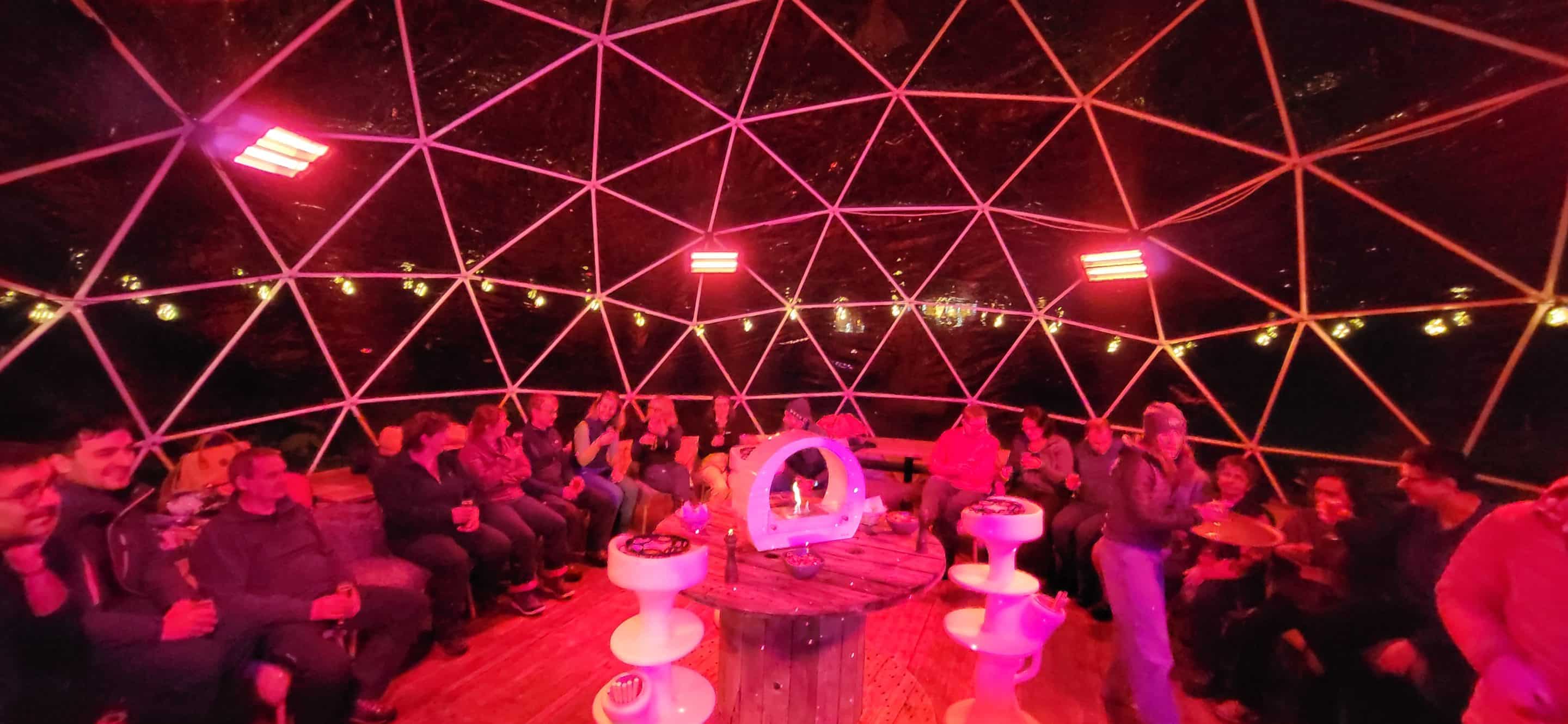Corporate evening under a heated geodesic dome at a ski resort
