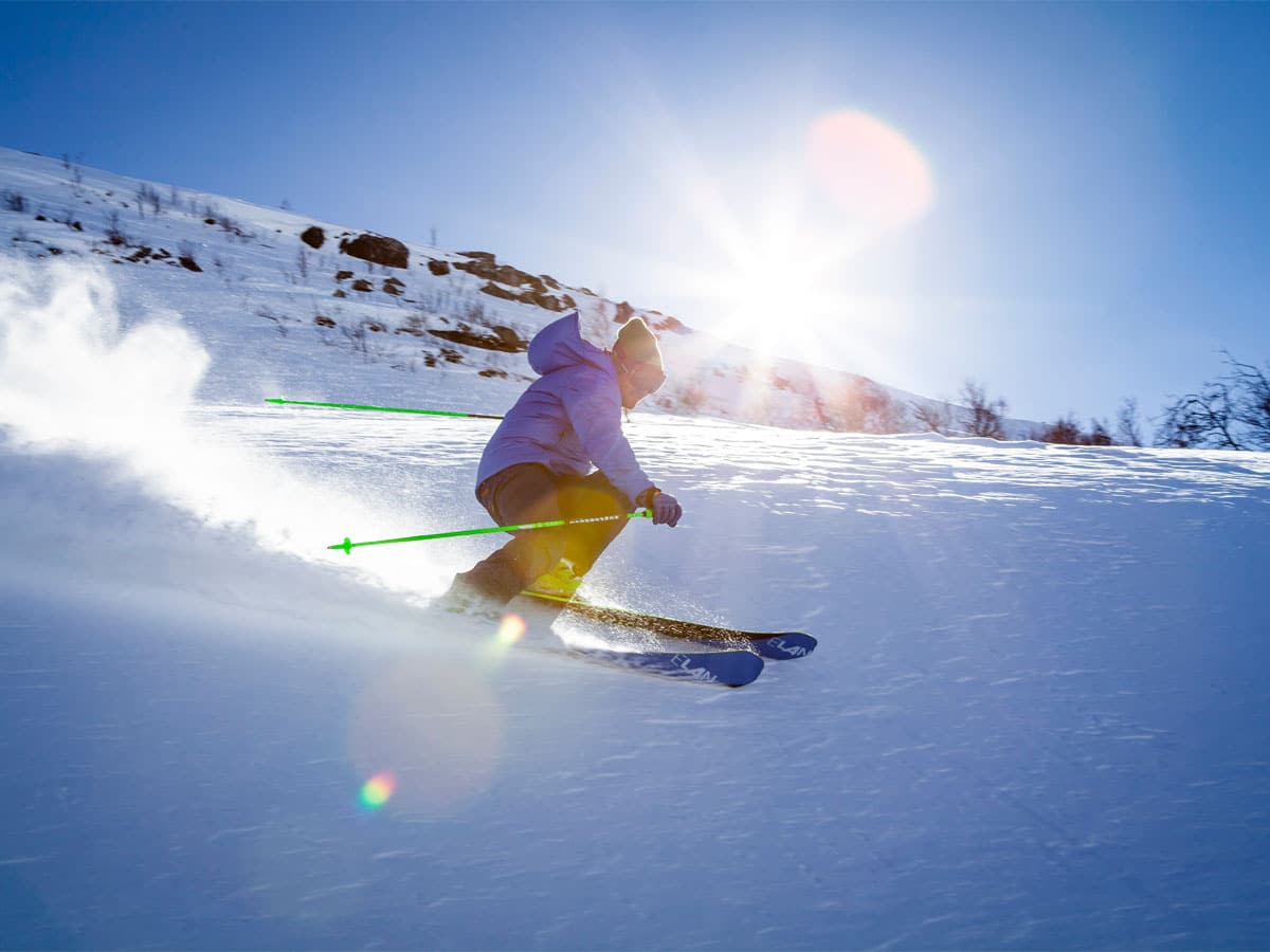 Skier on the Tarentaise ski area, powder snow and bright sunshine